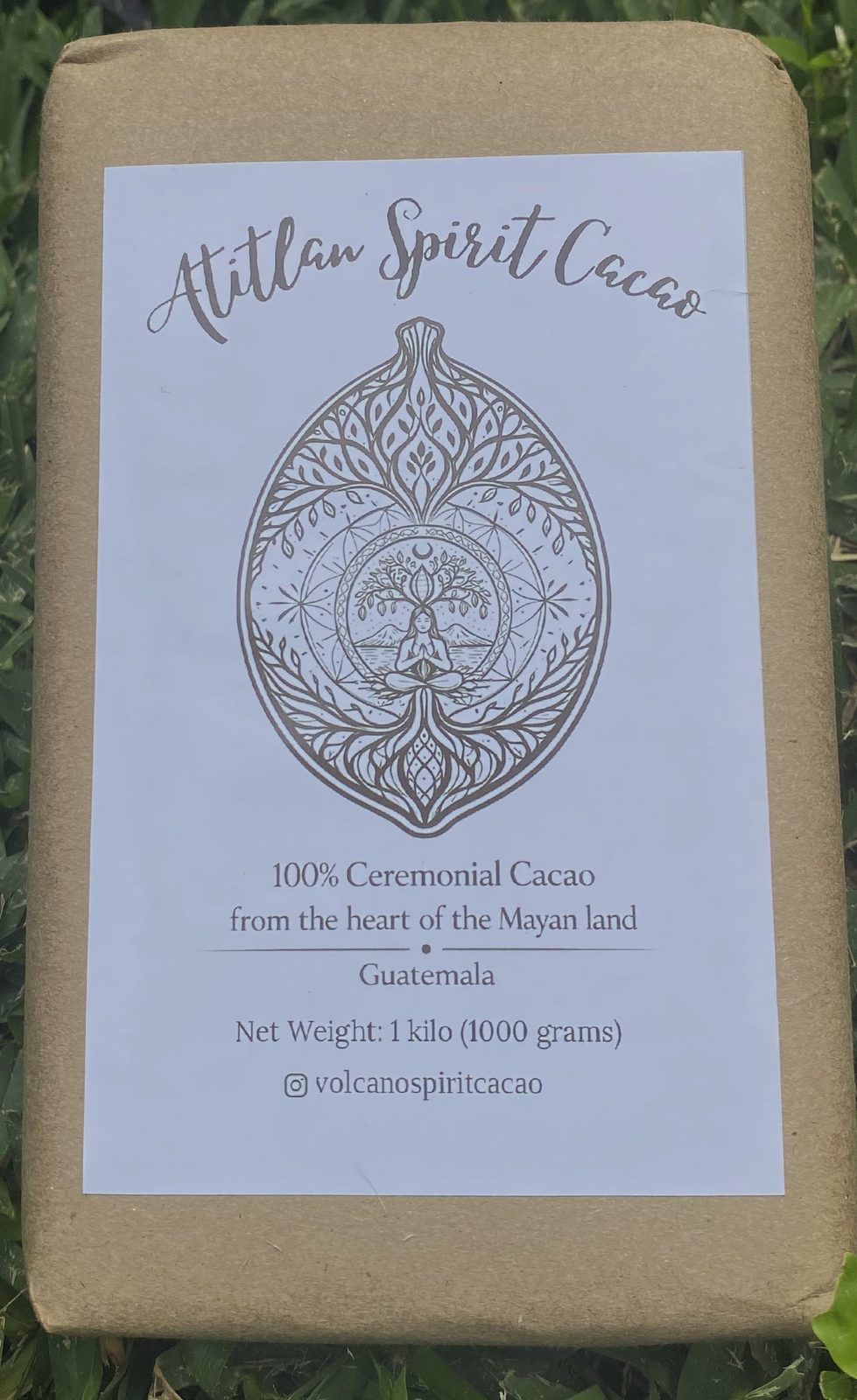 1kg block of Volcano Spirit ceremonial cacao wrapped in kraft paper