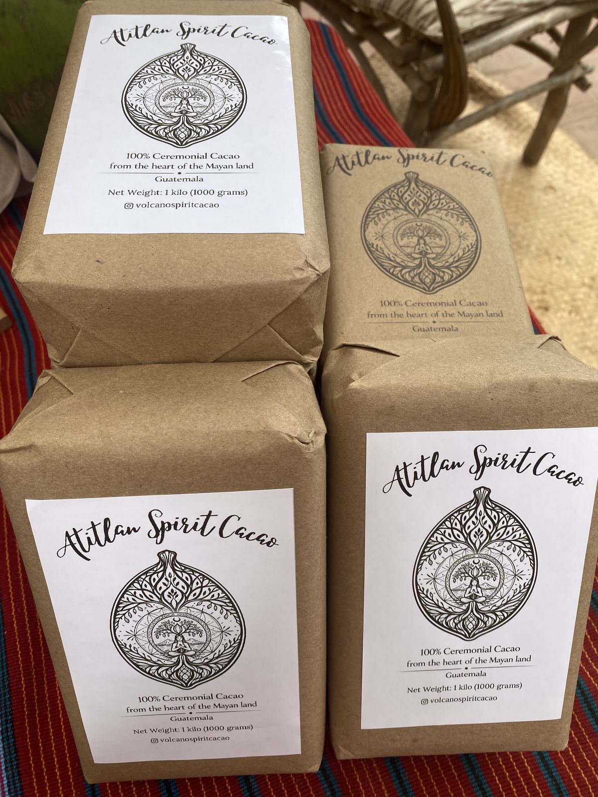 Several 1kg blocks of Volcano Spirit ceremonial cacao wrapped in kraft paper